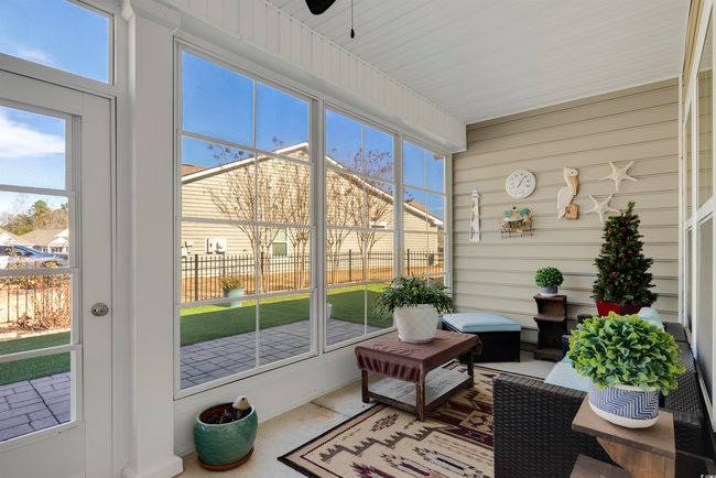 Sunroom featuring ceiling fan | Image 35