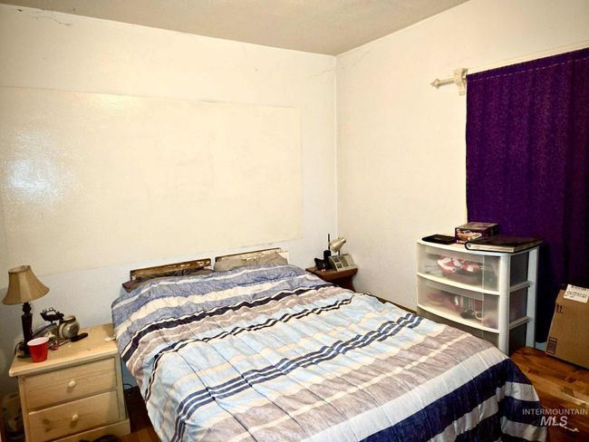 Bedroom with wood finished floors | Image 15