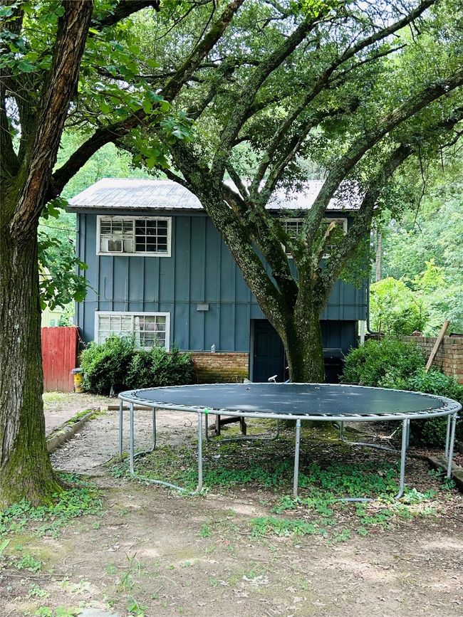 View of outbuilding featuring a trampoline | Image 4