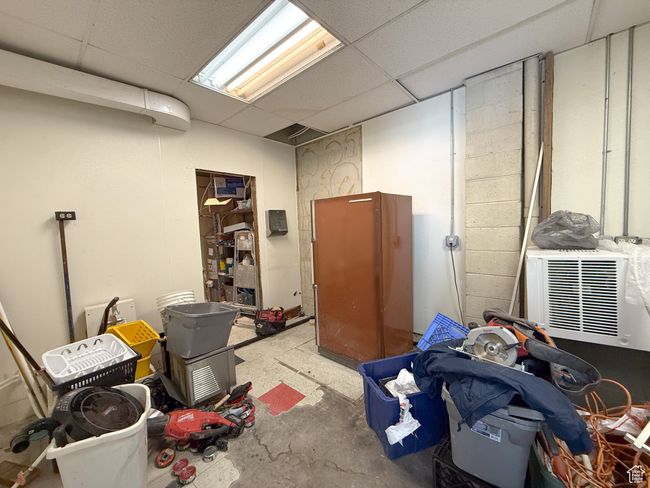 Basement with a paneled ceiling | Image 10