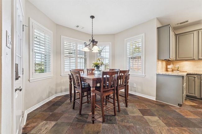 Start your day with coffee in a charming breakfast nook. | Image 12