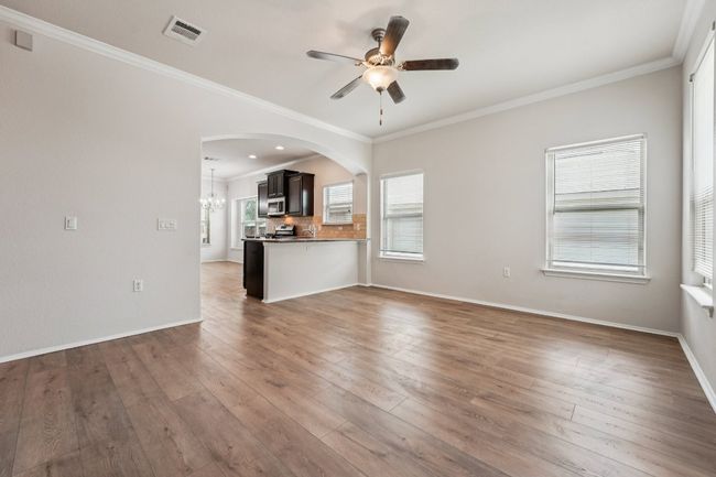 Featuring new floors and freshly painted walls. | Image 10