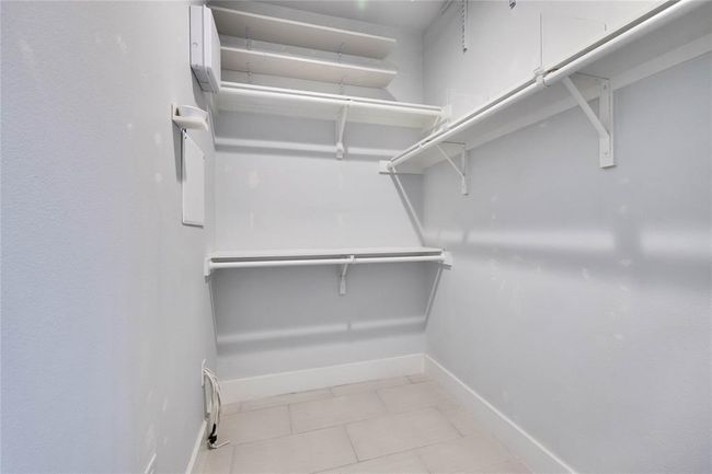 Spacious closet featuring tile patterned flooring | Image 19