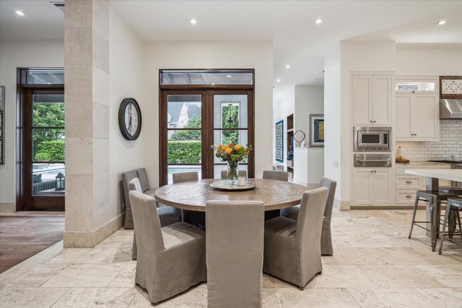 The breakfast area has great views to the outdoor gardens and pool. | Image 9