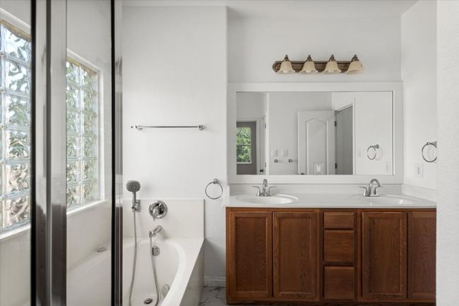 Full bathroom with a garden tub and double vanity | Image 27