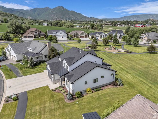 Aerial perspective of suburban area featuring a mountain backdrop | Image 54