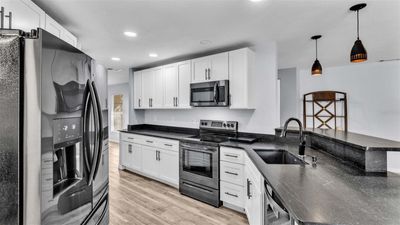 Kitchen view with White Shaker Cabinets, granite counters | Image 3