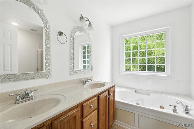 Another View of Primary Bathroom featuring a jetted tub and double vanity | Image 21