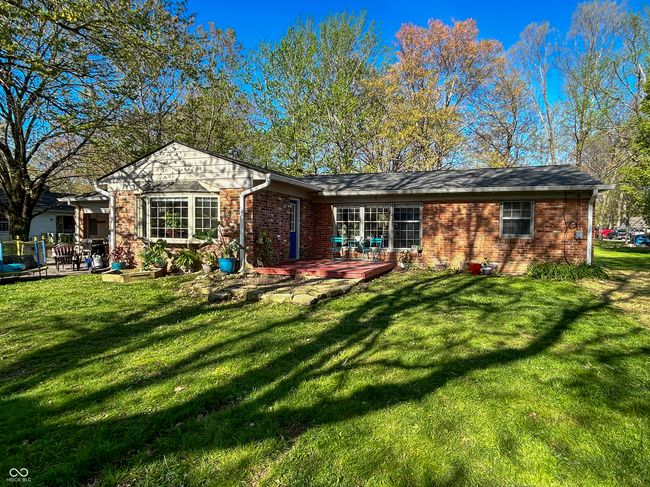 Spacious backyard, partially fenced, mature trees | Image 27