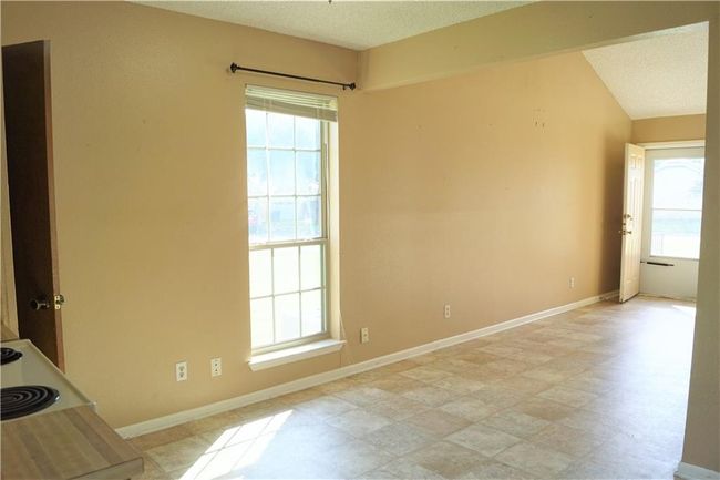 Empty room with baseboards and a textured ceiling | Image 5