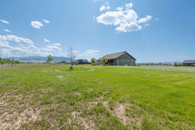 View of green lawn featuring a mountain view | Image 28