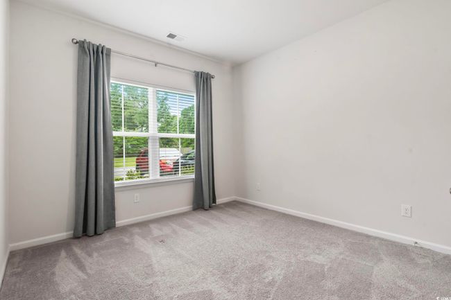 Unfurnished room with carpet floors and baseboards | Image 28