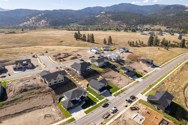 Aerial overview of property's location with a mountainous background | Image 54