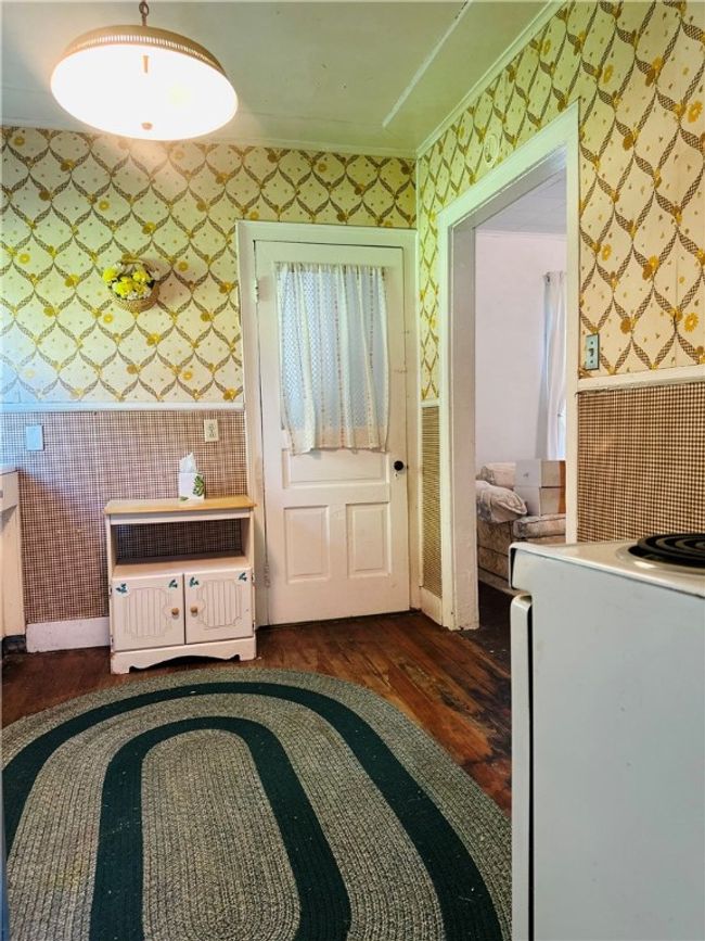 Unit 2 - Kitchen - Door leads to the full bath | Image 24
