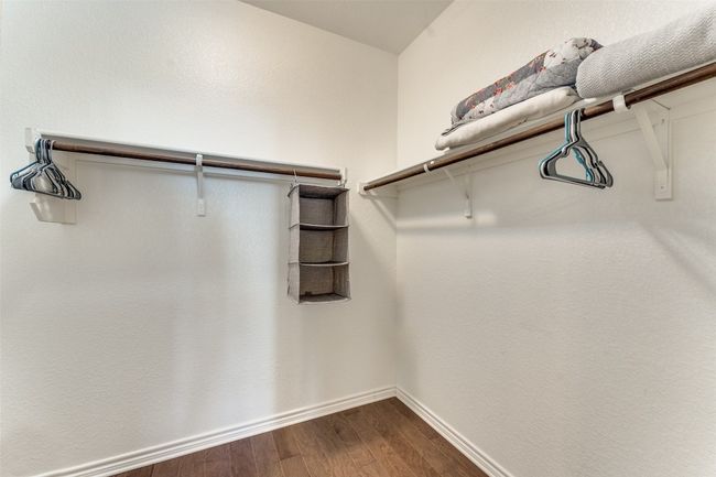 Continuing through the owners suite bath, you will find a spacious walk-in closet | Image 17