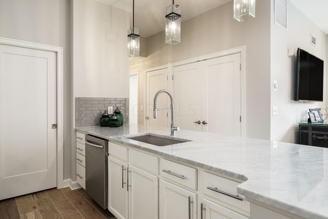 high end kitchen looking towards the bedrooms | Image 7