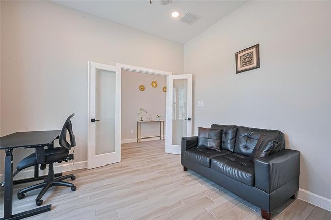 Perfect for remote work or focused study, this space combines comfort and productivity in a beautifully lit setting | Image 18