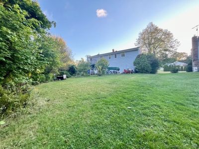 Great, green back yard with plantings, walk out porch AND walk out patio! | Image 2