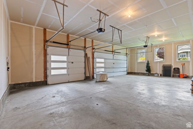 Garage featuring a garage door opener | Image 38