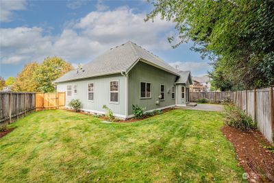 You'll love the fully fenced backyard with sprinkler system and low maintenance landscaping. | Image 2