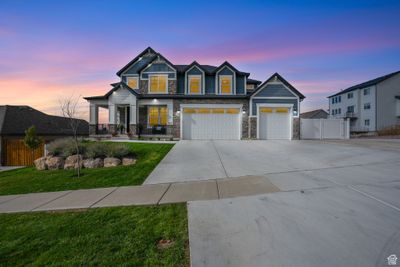 Craftsman-style house featuring a lawn and a garage | Image 3