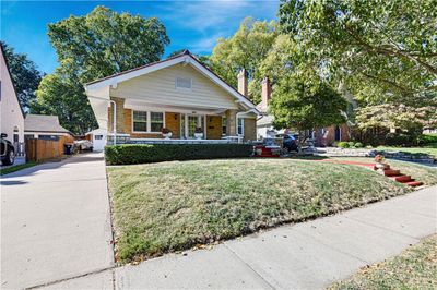 Bungalow-style home featuring a porch and a front lawn | Image 2