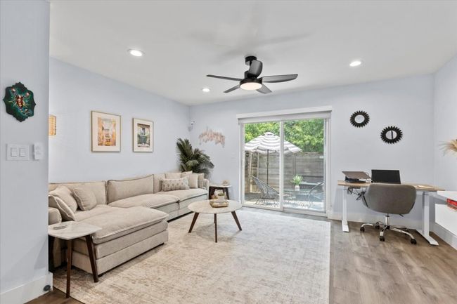 Living room featuring an office area, wood finished floors, ceiling fan, and recessed lighting | Image 10