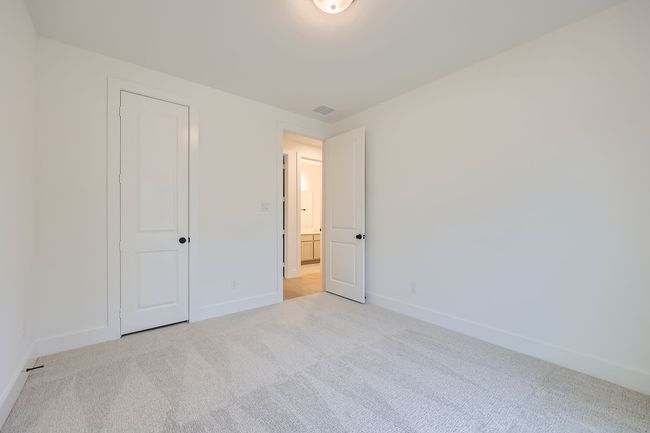 Unfurnished bedroom with baseboards, carpet flooring, and visible vents | Image 19