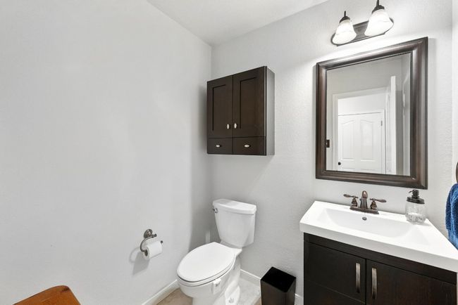 Bathroom featuring vanity and toilet | Image 26