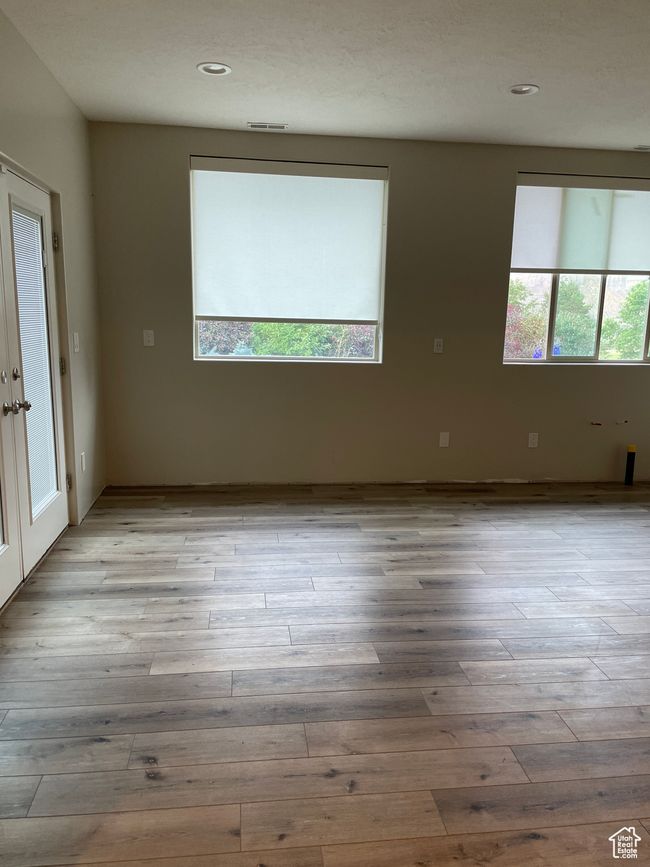 Spare room with light wood-style floors and recessed lighting | Image 16