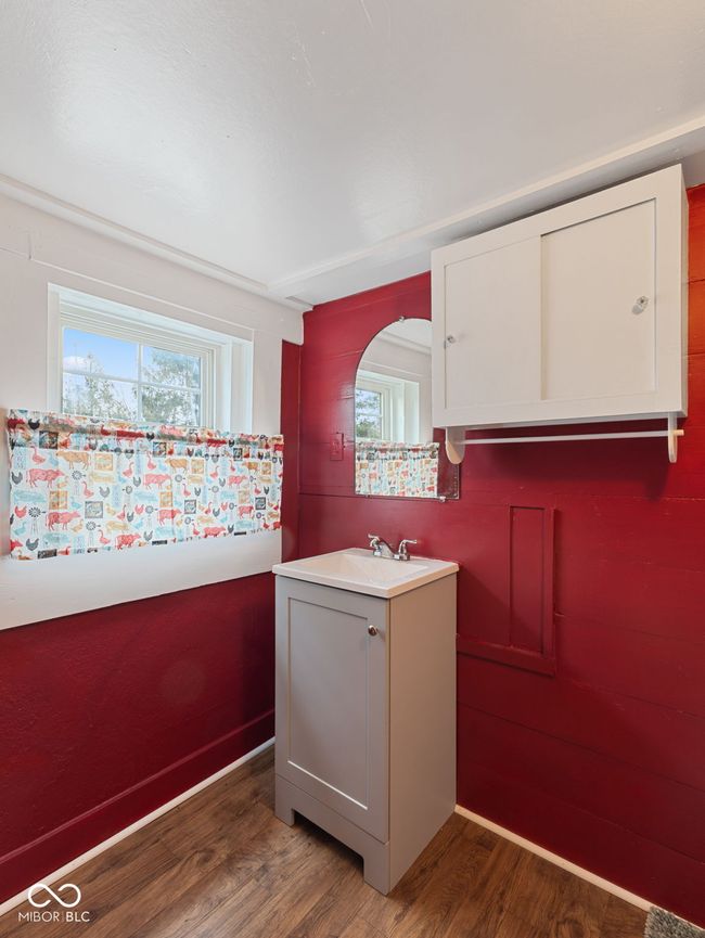 interior space featuring plenty of natural light, light countertops, wood finished floors, and a sink | Image 31