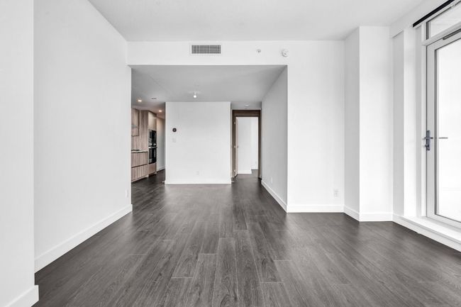 Empty room featuring dark wood-type flooring and baseboards | Image 10
