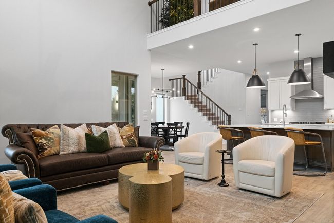 This angle showcases the open layout of the home along with views of the 2nd level that overlooks the first. | Image 10