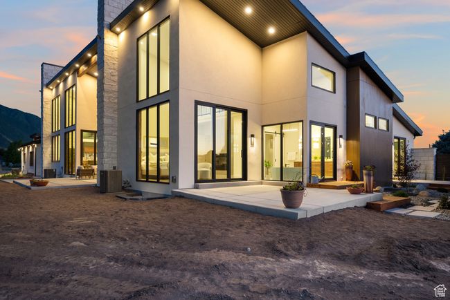 Rear view of house with a patio and stucco siding | Image 87