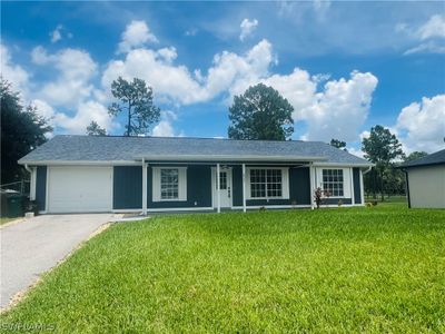 Single story home with a garage and a front lawn | Image 3