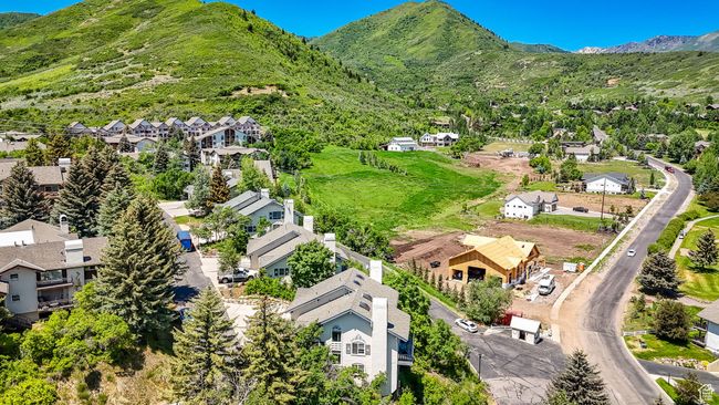 Aerial view of residential area with a mountain backdrop | Image 27