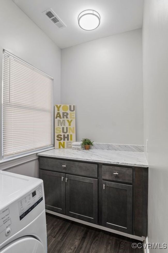 Laundry room featuring cabinet space | Image 21