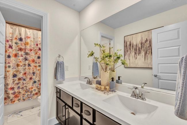 Upstairs full bathroom has dual sinks and fixtures on all the cabinetry. | Image 25