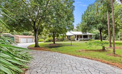 7370 Sw Rattlesnake Run, House other with 3 bedrooms, 2 bathrooms and 5 parking in Palm City FL | Image 1