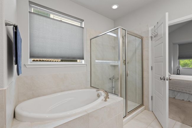 Unwind in the relaxing deep soaking tub (not jetted!) or in the glass-enclosed walk-in shower. | Image 18
