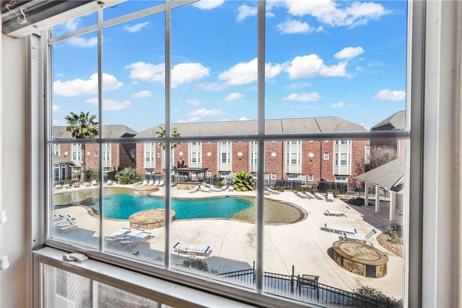 View from bedroom overlooking the pool. | Image 10