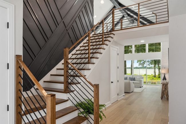 Off entry staircase leading to 3 bedrooms and second living space | Image 22
