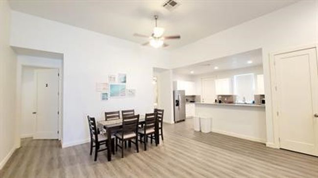 Dining room featuring light wood-type flooring, ceiling fan, and recessed lighting | Image 6
