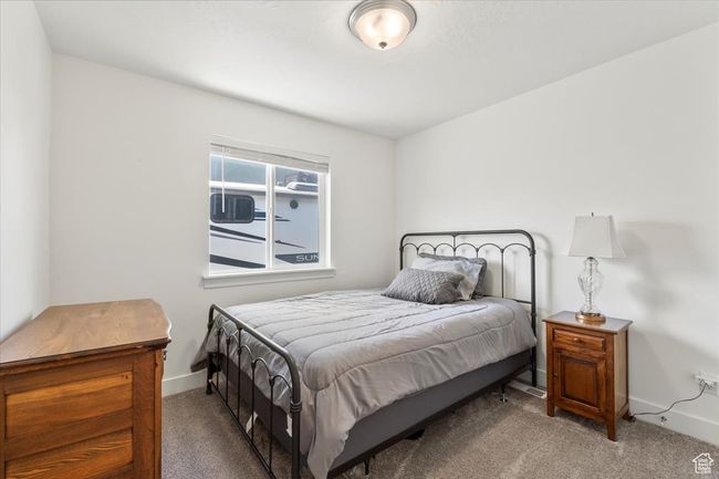 Carpeted bedroom featuring baseboards | Image 21