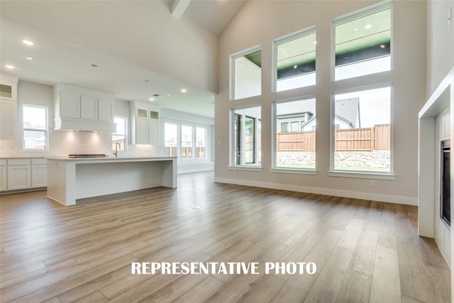 Spacious and light filled, this family room is large enough for the entire family! REPRESENTATIVE PHOTO. | Image 9
