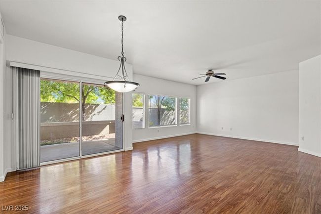 Resort-Style First Floor Living in Prime Summerlin South! Located in a highly sought-after gated Garden Terrace community, complete with a spacious 2-car tandem garage. Step inside to an expansive open-concept living space filled with warm natural light and designer touches throughout. Featuring a brand-new air conditioning system and a recently upgraded water heater, this turnkey residence is move-in ready and designed for effortless living. | Image 13