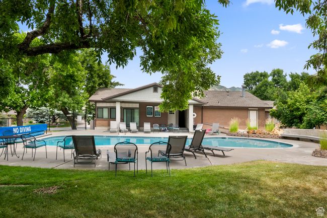 Community pool with a patio | Image 36