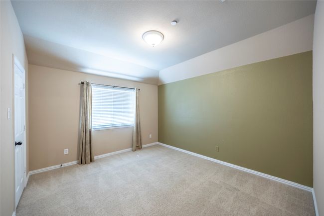 Empty room featuring light colored carpet and baseboards | Image 26