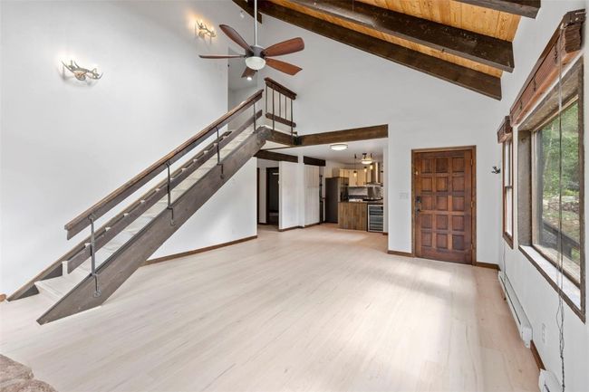 Living room with stairs up to the Master Bedroom and 2nd Bedroom plus bonus room | Image 14