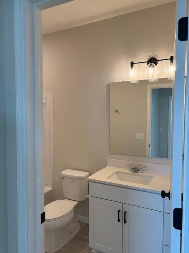 Main Level Bath with vanity for storage. | Image 15